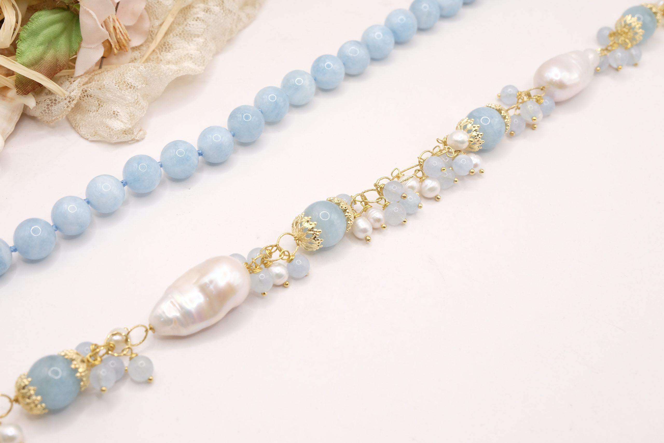 ARTISAN NECKLACE WITH AQUAMARINE PEARL BUNCHES AND DECOLTE' (9)