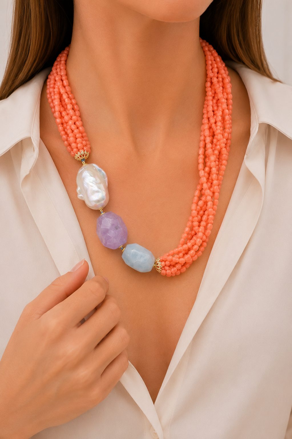 Handcrafted multi-strand necklace with bamboo coral, salmon, large pearl, amethyst, and aquamarine.