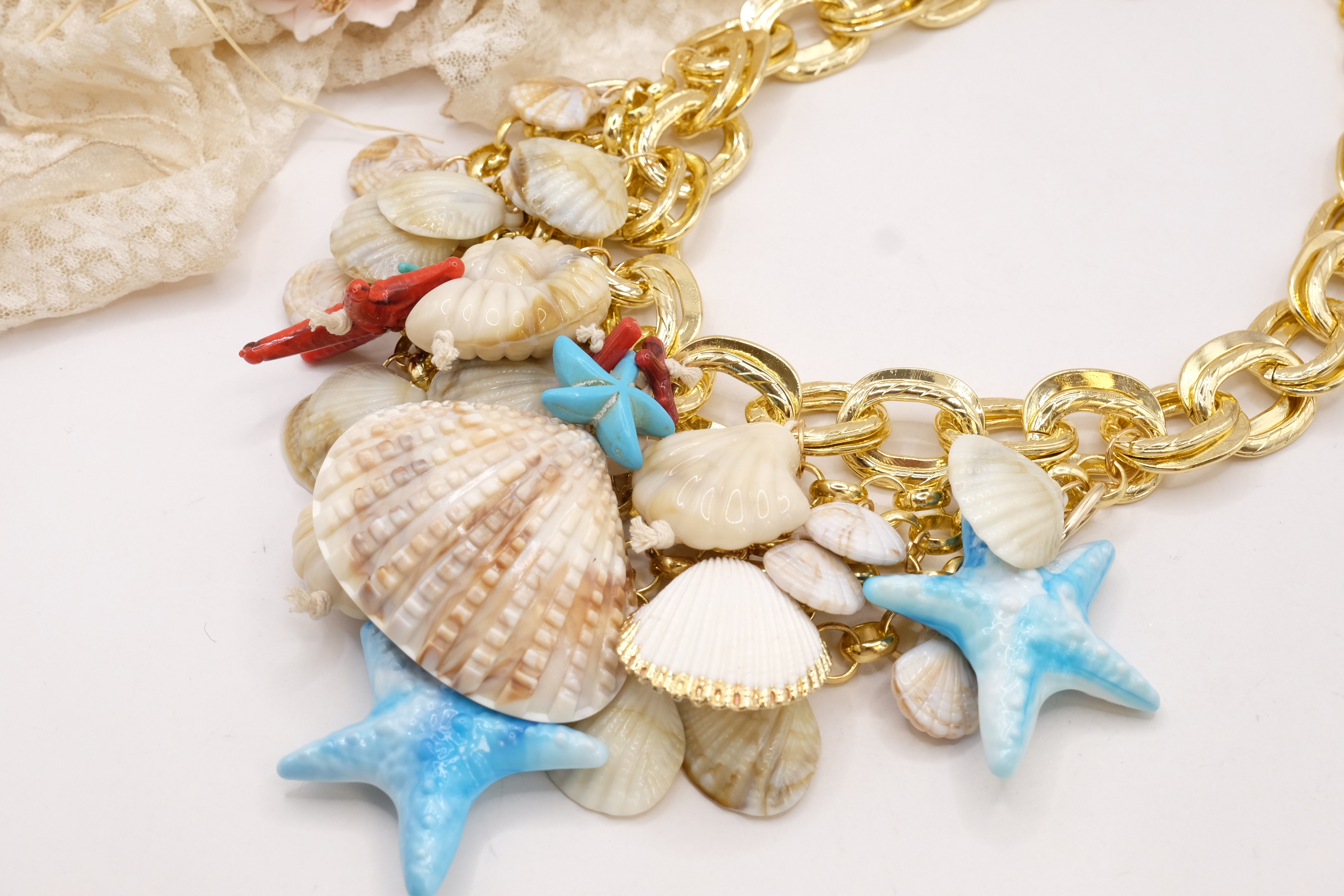 COLLANA MULTIFILO CONCHIGLIE E STELLE MARINE TURCHESE RESINA OTTONE (3)